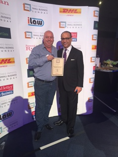 Theo Paphitis presents Bill Bailey with a Small Business Sunday award.
