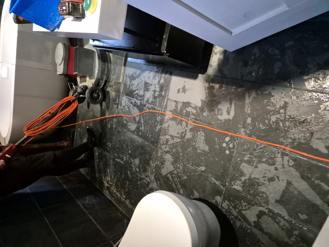Limescale Stained Slate Tiled Bathroom Floor During Cleaning Wimbledon